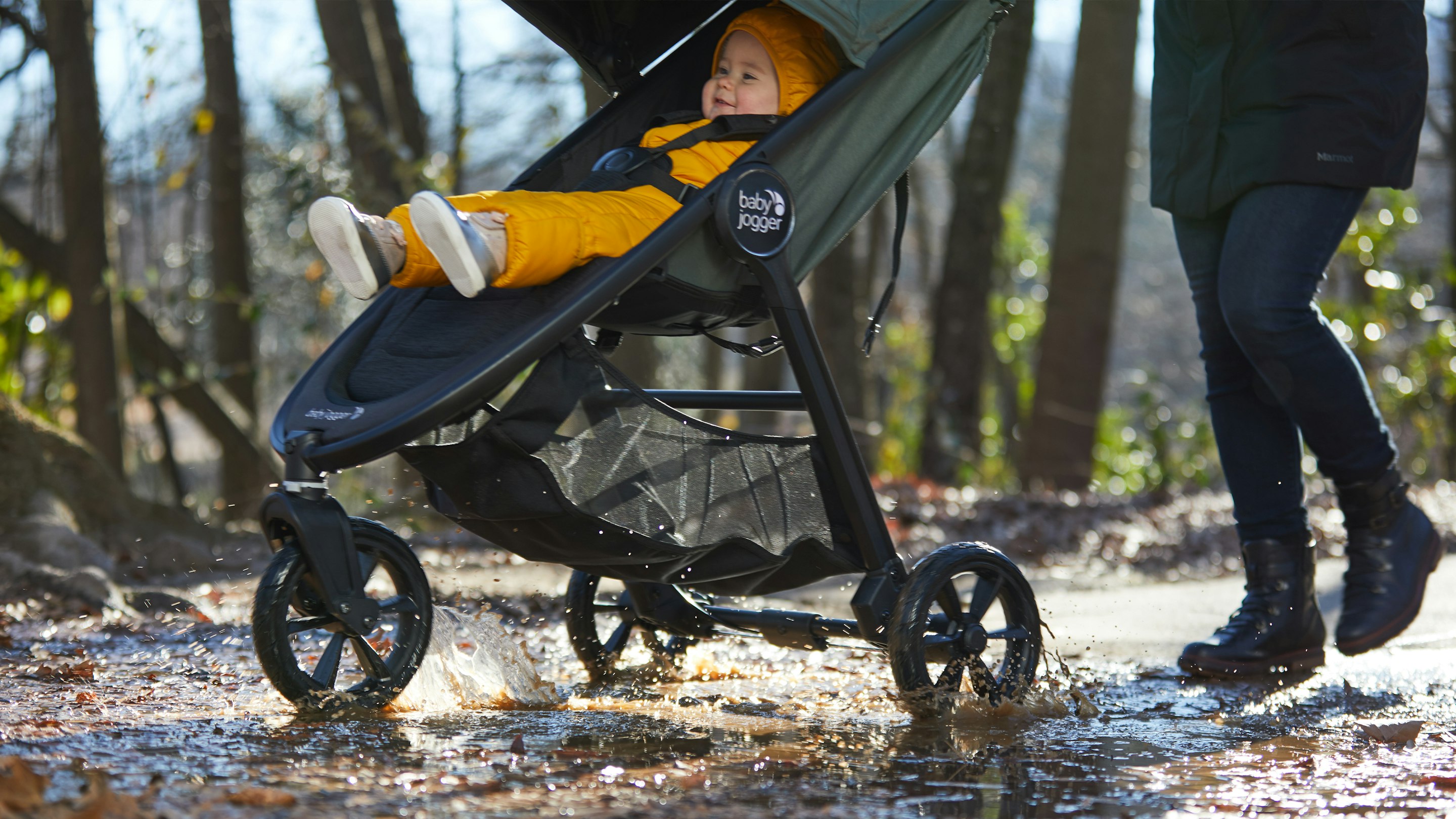 stroller going through mud and leaves in fall season
